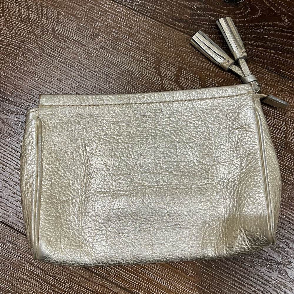 Coach clutch / wristlet light gold color
